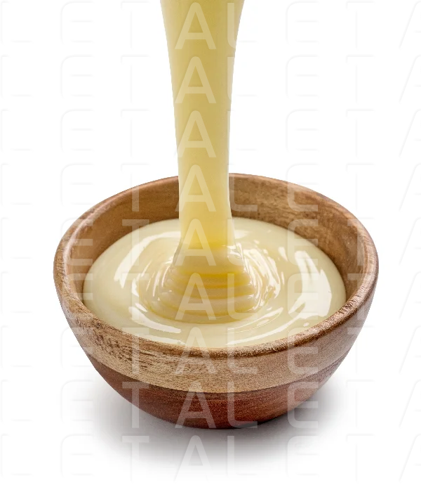 condensed milk pouring into bowl