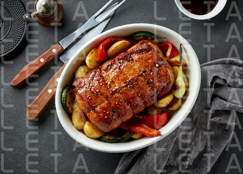 whole roast pork and vegetables