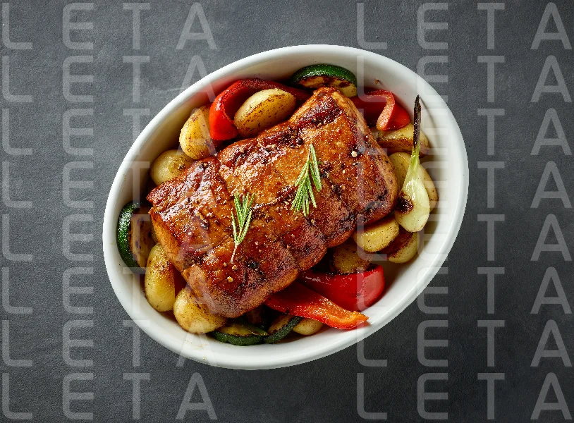 whole roast pork and vegetables