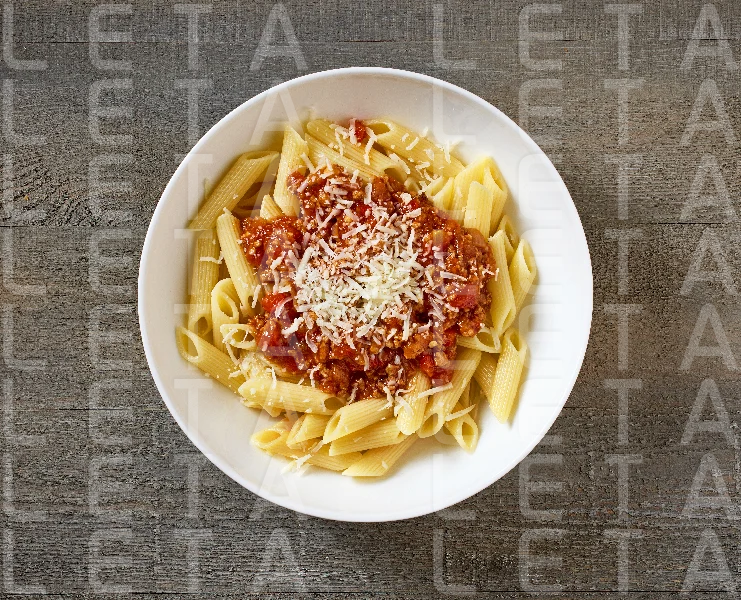 bowl of pasta penne with sauce bolognese
