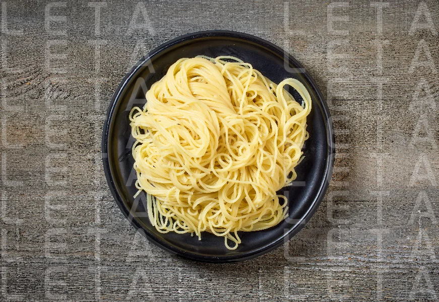 pasta spaghetti on black plate