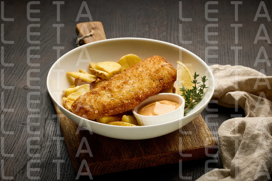 bowl of breaded fish fillet and fried potato wedges