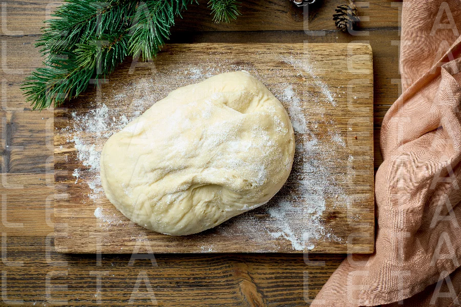 dough on wooden cutting board