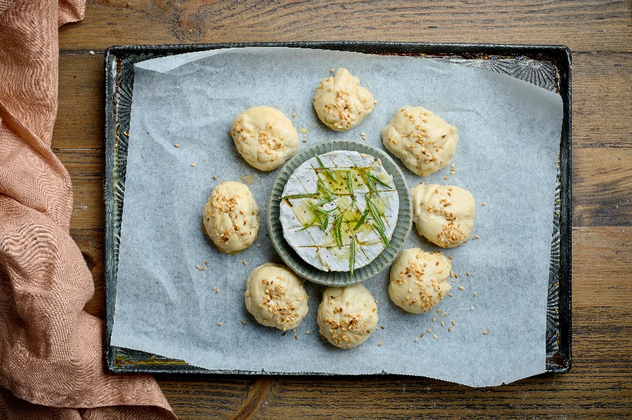 raw yeast dough buns and brie cheese