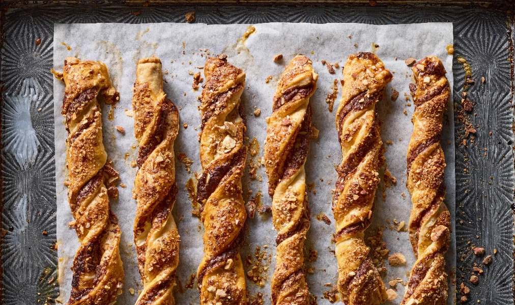 freshly baked pastries with chocolate cream and almonds