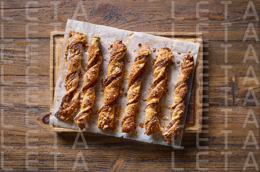 freshly baked pastries with chocolate cream and almonds