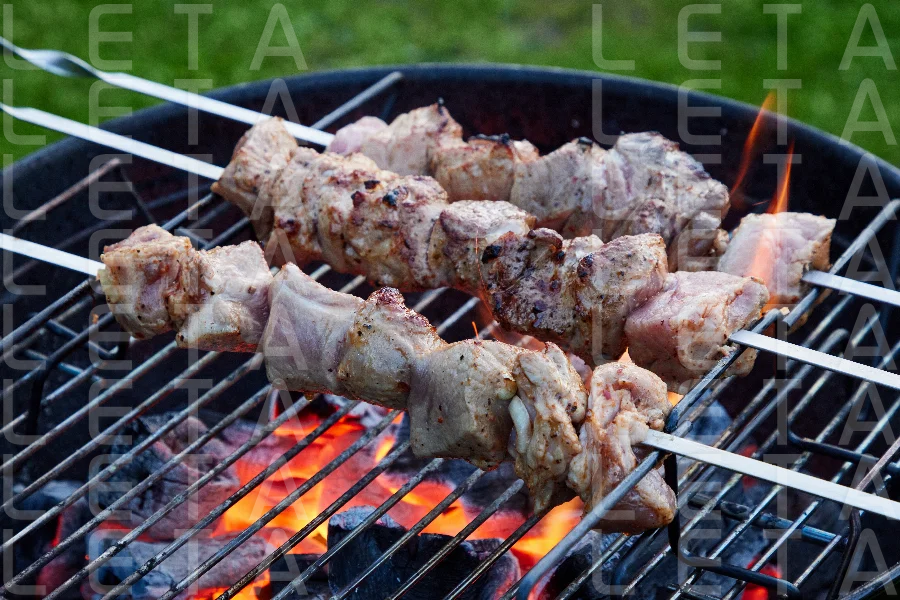 grilled marinated pork meat skewers