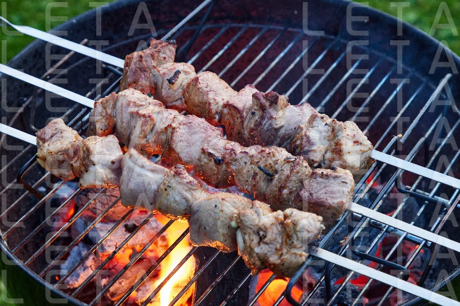 grilled marinated pork meat skewers