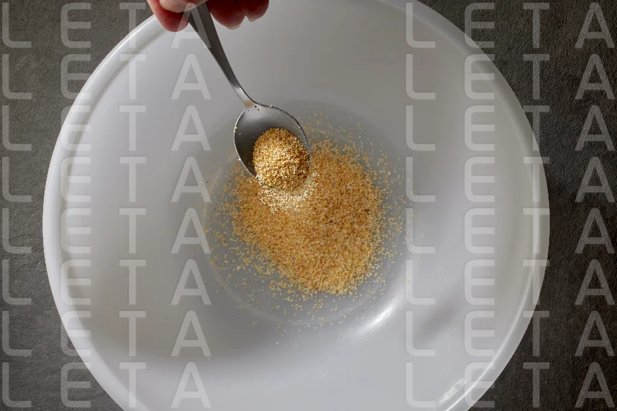 spoon of ground dried garlic spice
