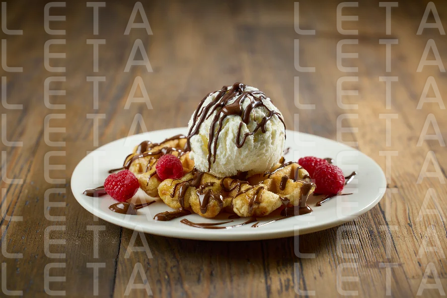 plate of belgian waffle with ice cream