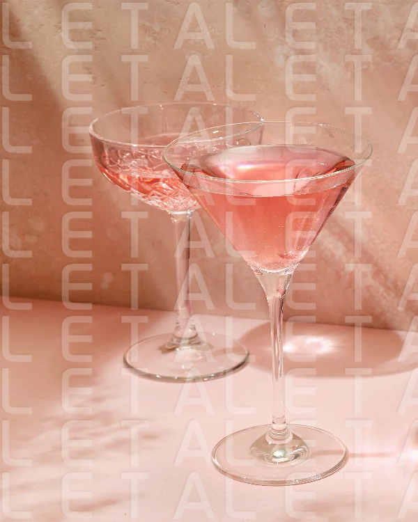 various glasses on pink background