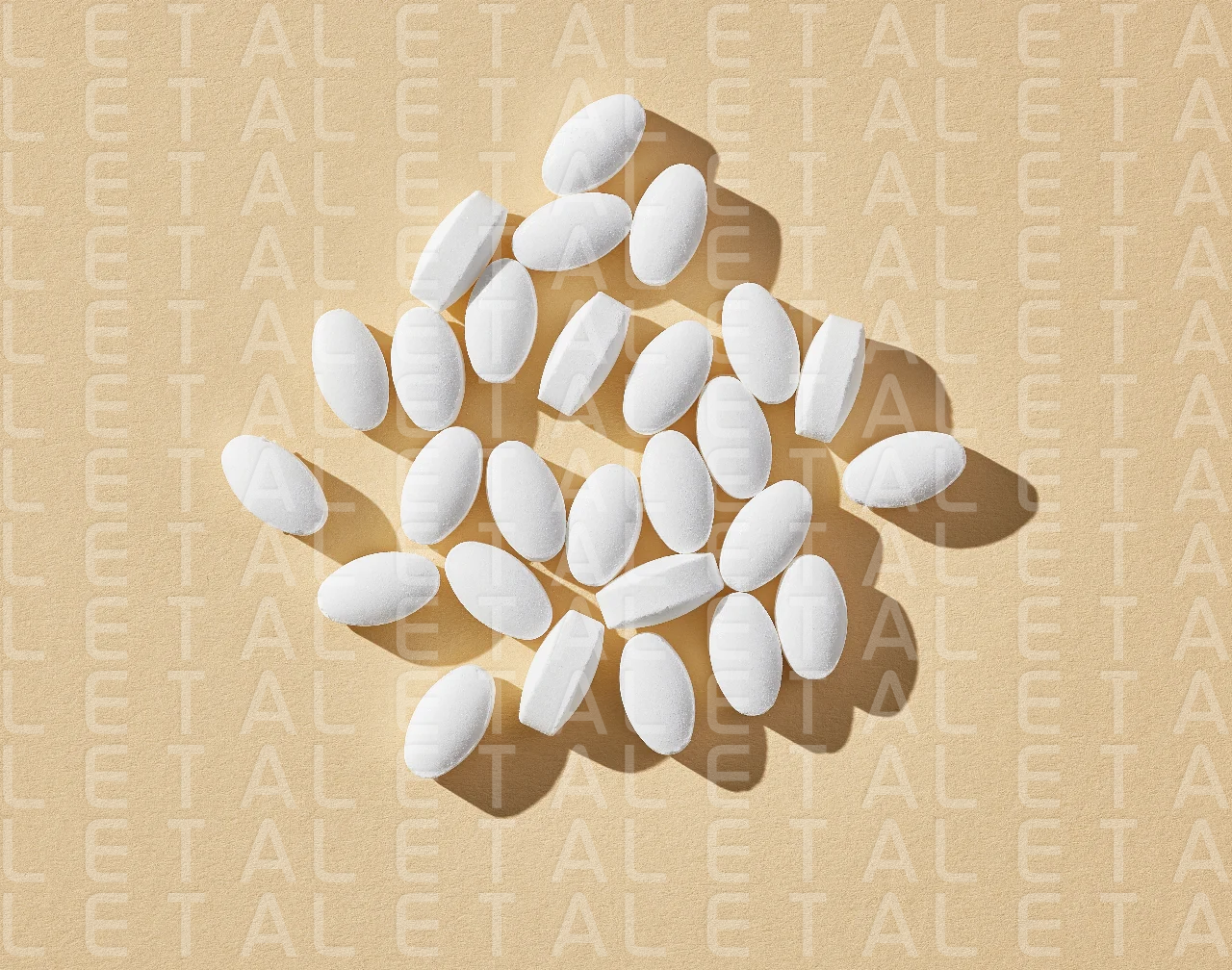 white pills on beige background