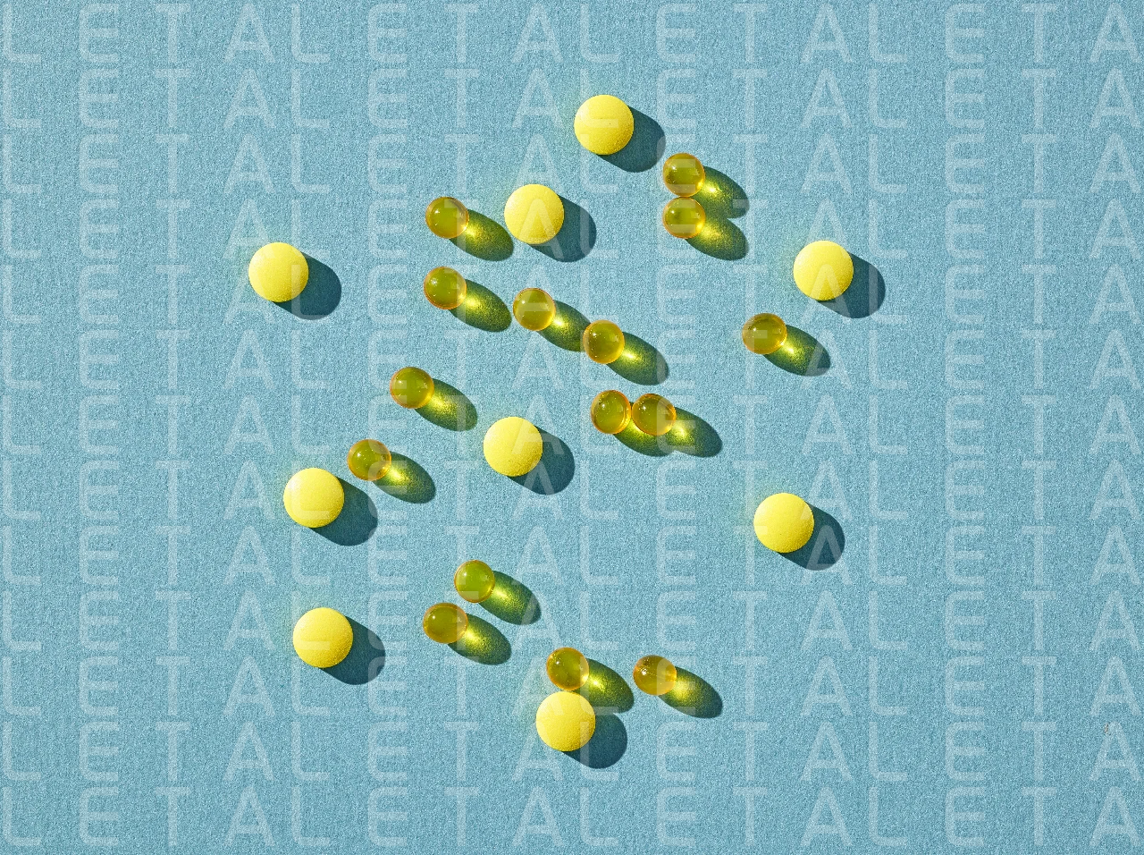 yellow pills on blue background