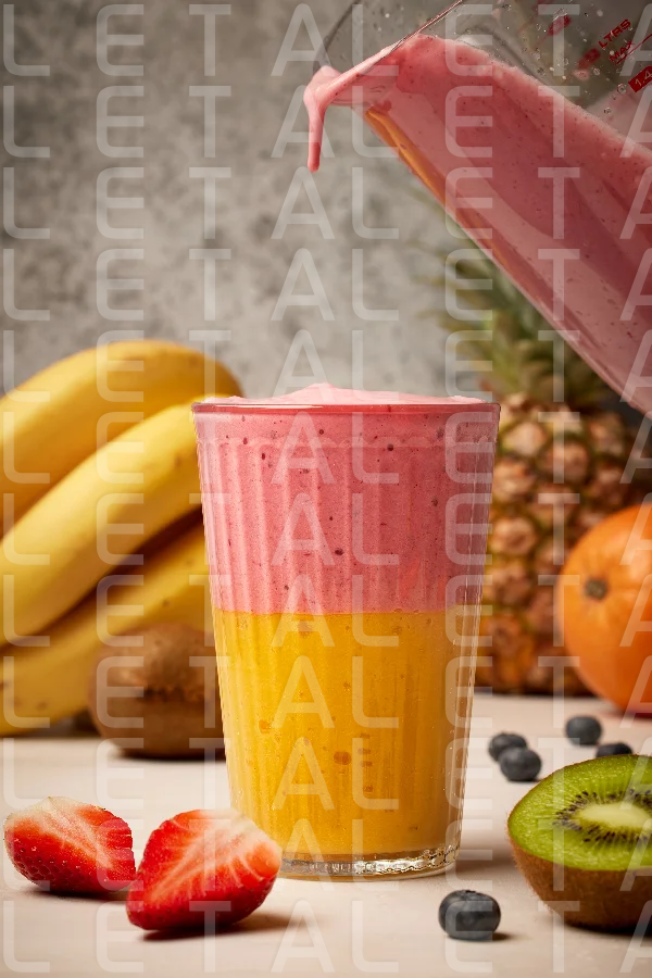 glass of fresh delicious colorful smoothie
