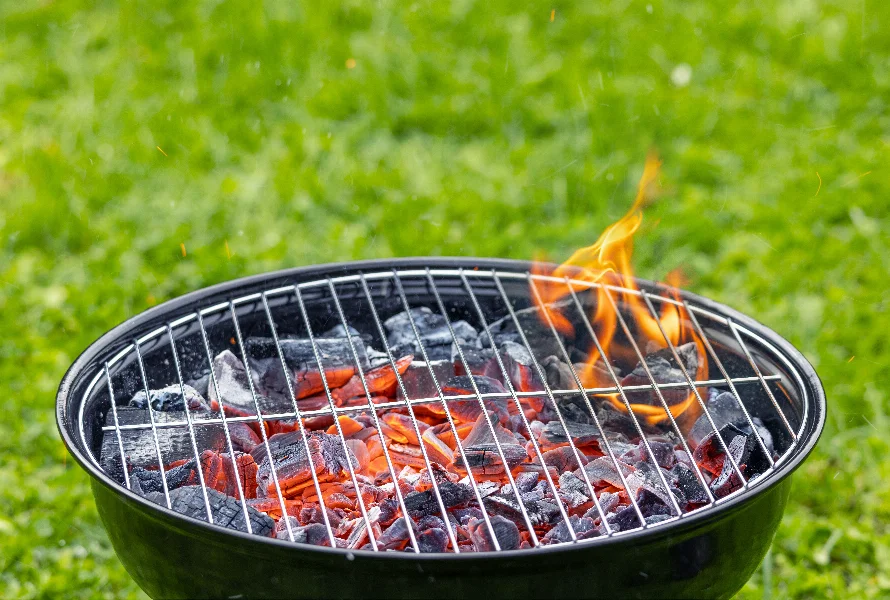 burning charcoal grill