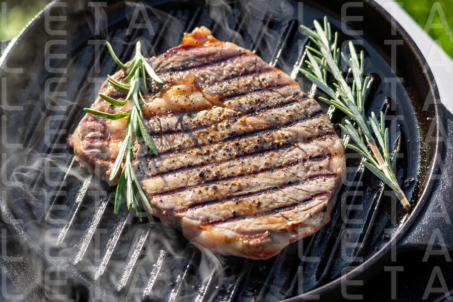 beef steak on grilling pan