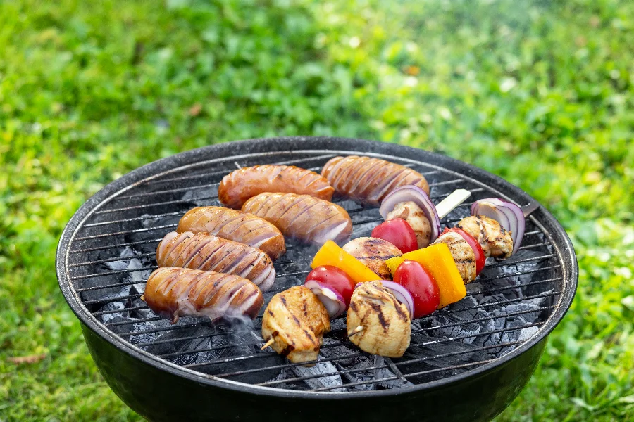 grilled sausages and meat vegetables skewers