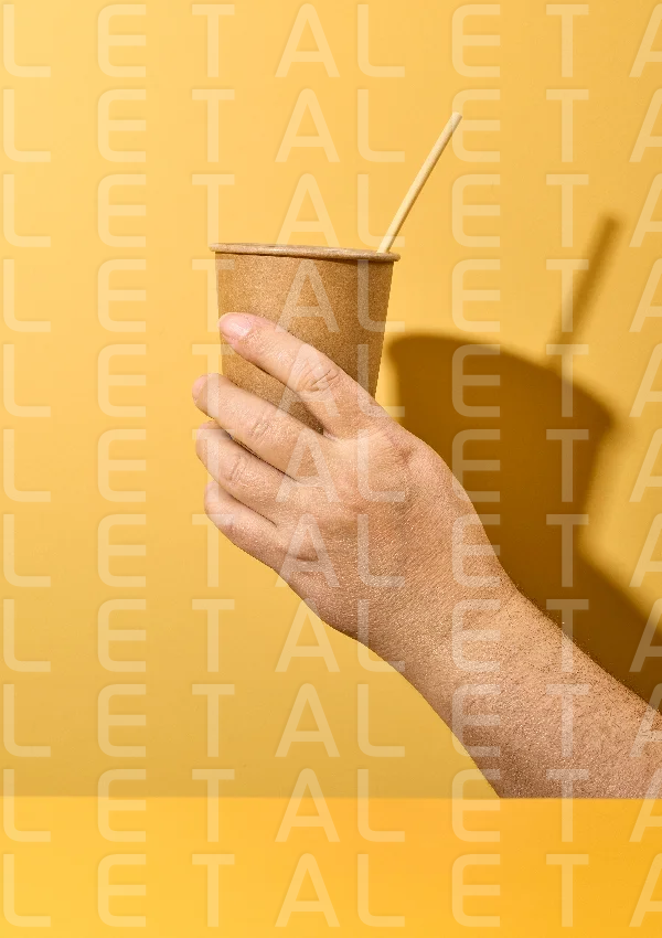 take away cup in human hand