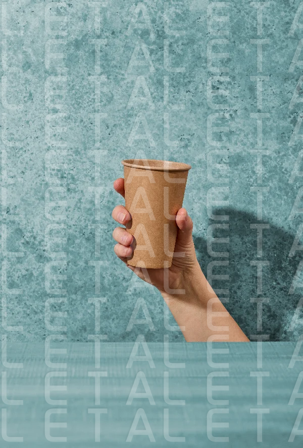 paper coffee cup in human hand
