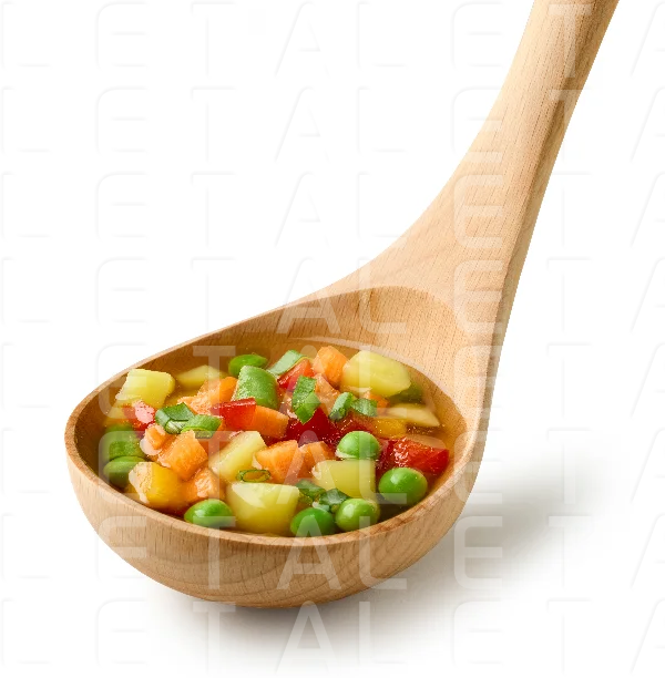vegetable soup in wooden ladle