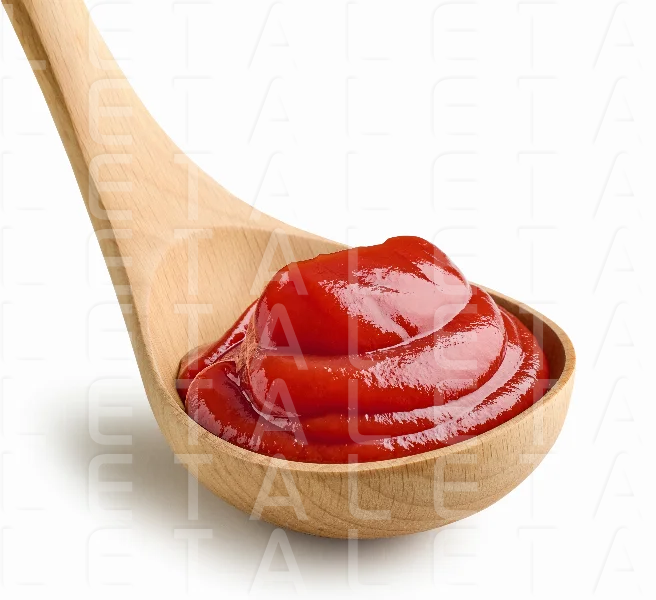 tomato sauce in wooden ladle