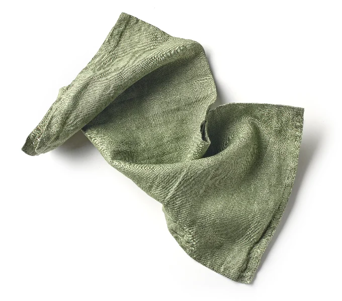 crumpled green cotton napkin