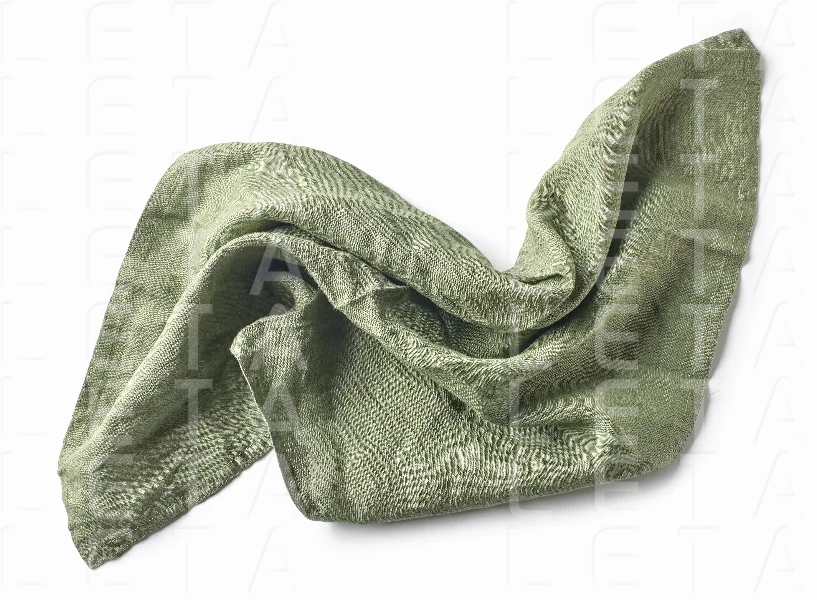 crumpled green cotton napkin